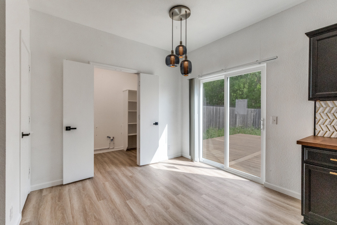 9204 Magna Carta Loop Austin, TX 78754 - Photo 13 of 27 Unfurnished dining area with light wood finished floors and baseboards