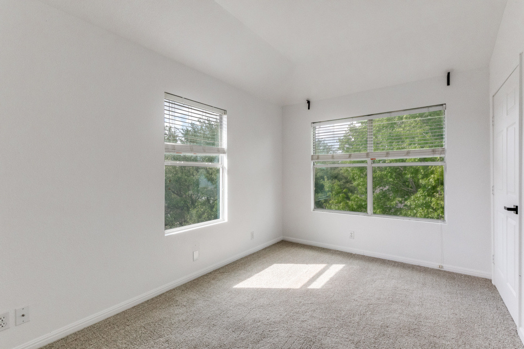 9204 Magna Carta Loop Austin, TX 78754 - Photo 20 of 27 Spare room featuring light colored carpet and plenty of natural light