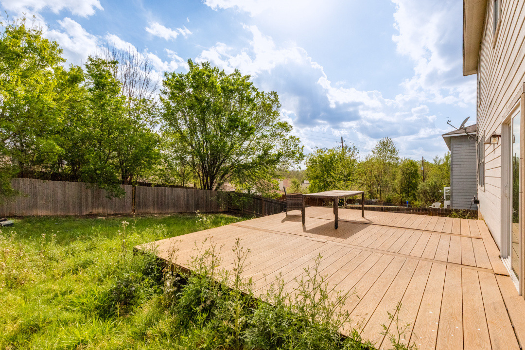 9204 Magna Carta Loop Austin, TX 78754 - Photo 24 of 27 Wooden terrace featuring a fenced backyard