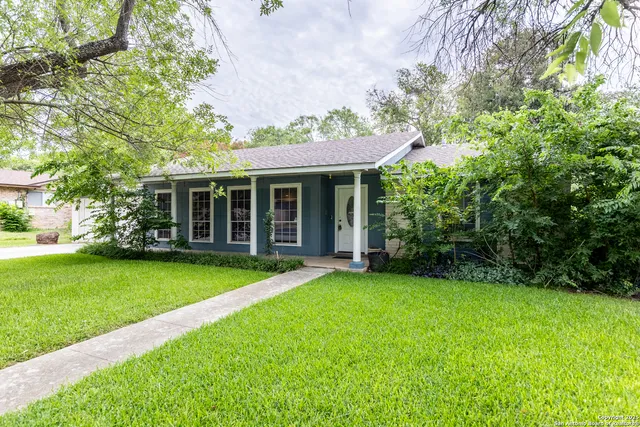 a view of a house that has a garden