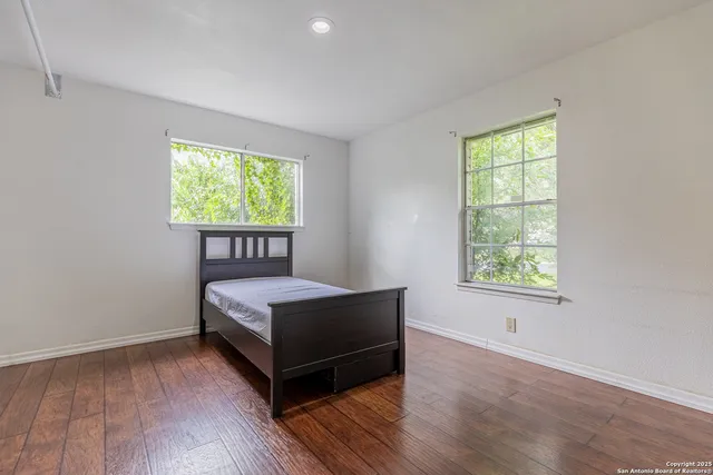 a room with a bed and window