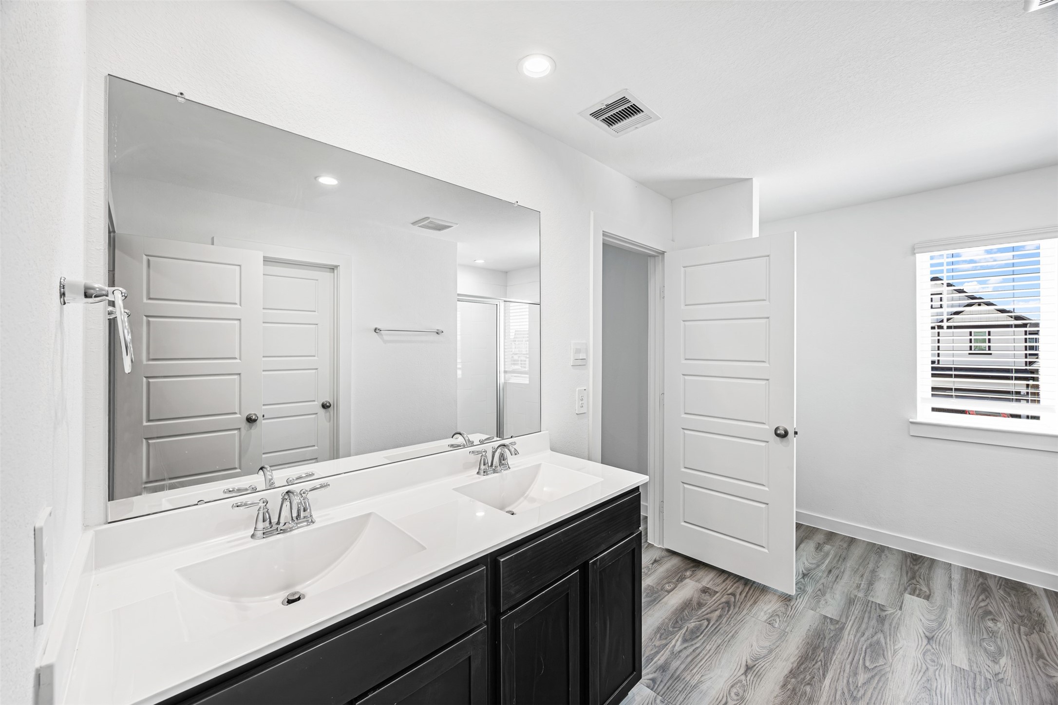 12305 Brandenburg Gate Road Houston, TX 77047 - Photo 12 of 22 a bathroom with a sink shower and a mirror