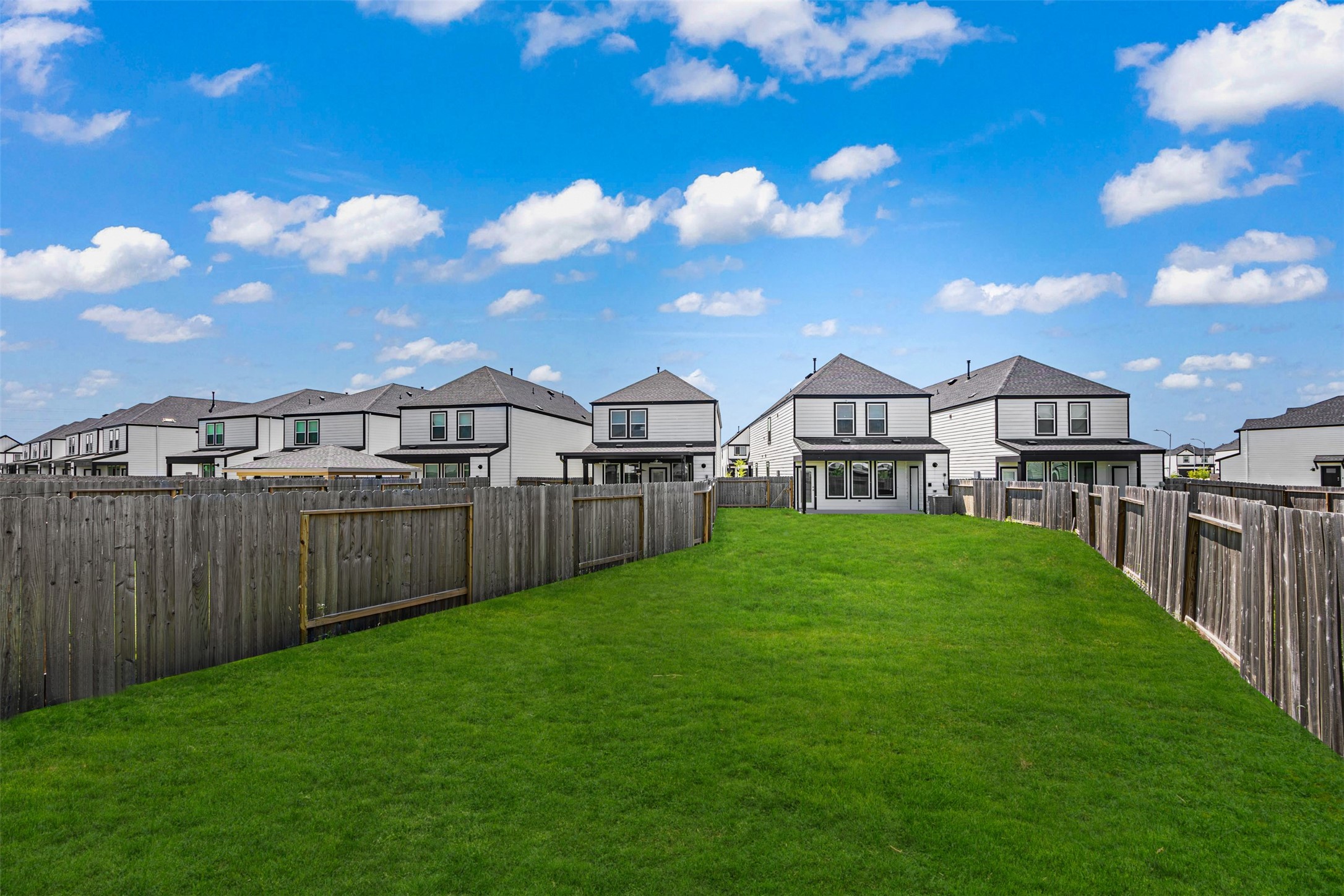 12305 Brandenburg Gate Road Houston, TX 77047 - Photo 20 of 22 a view of a house with a yard