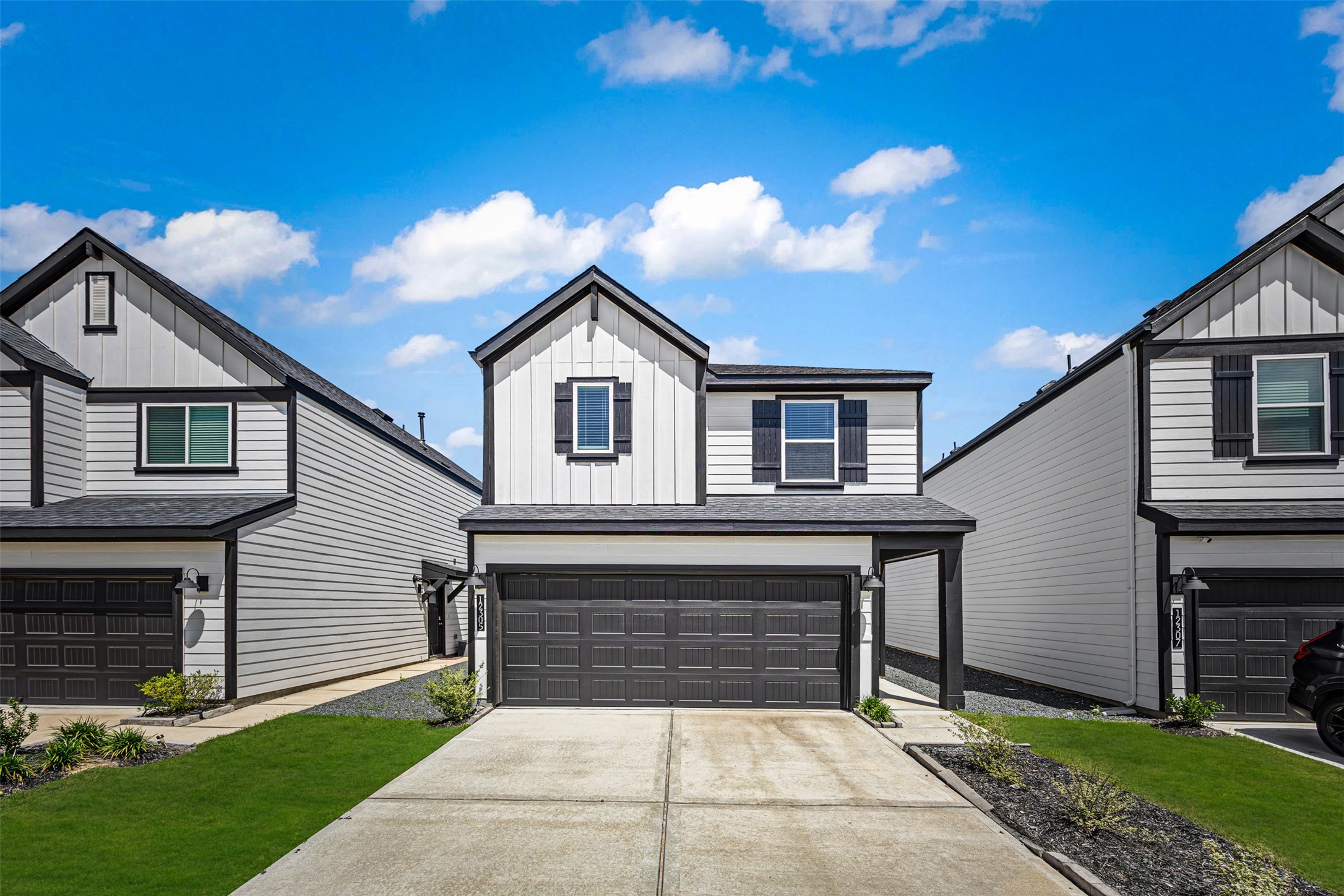 12305 Brandenburg Gate Road Houston, TX 77047 - Photo 2 of 22 a front view of a house with a yard