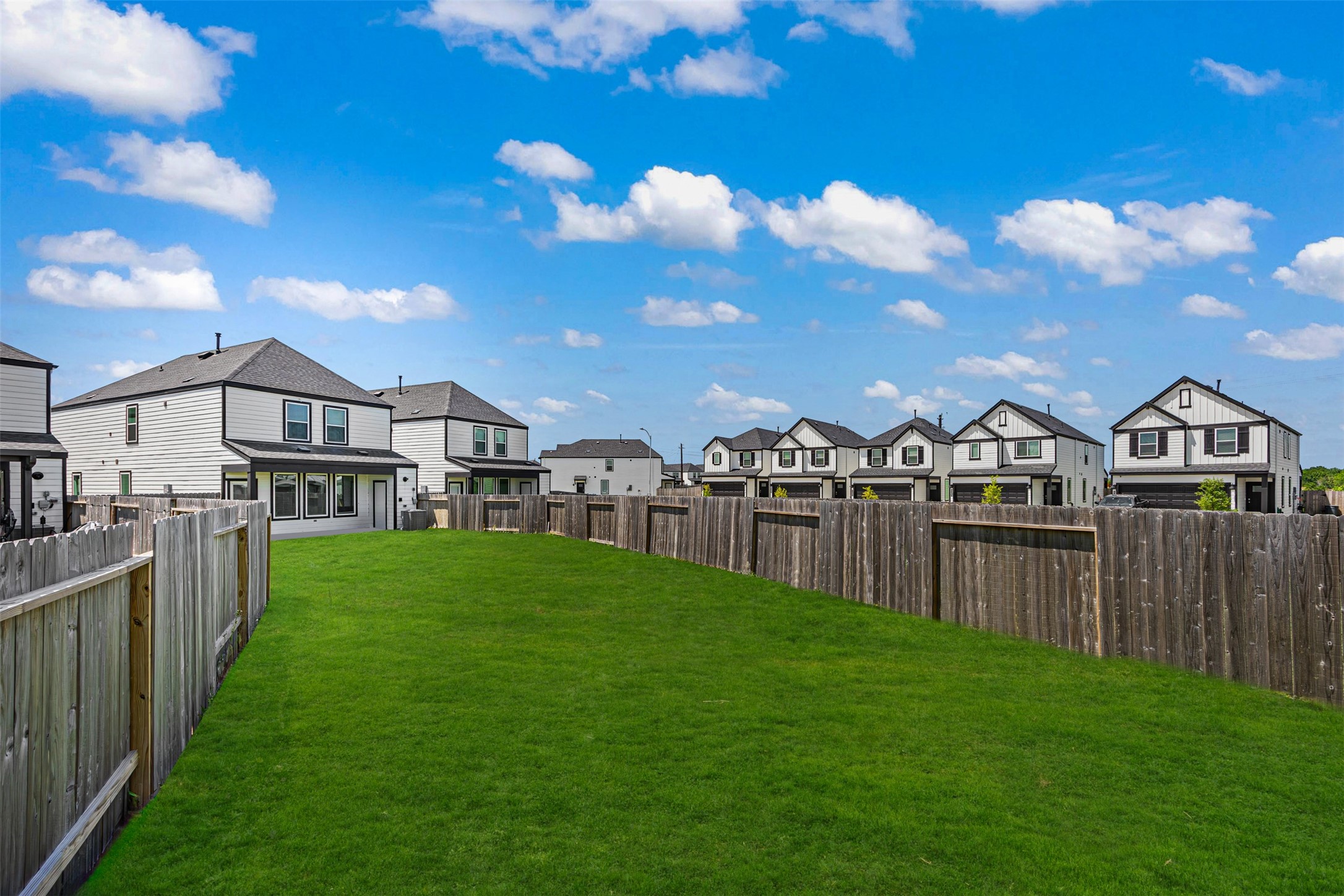 12305 Brandenburg Gate Road Houston, TX 77047 - Photo 21 of 22 a view of a house with a big yard