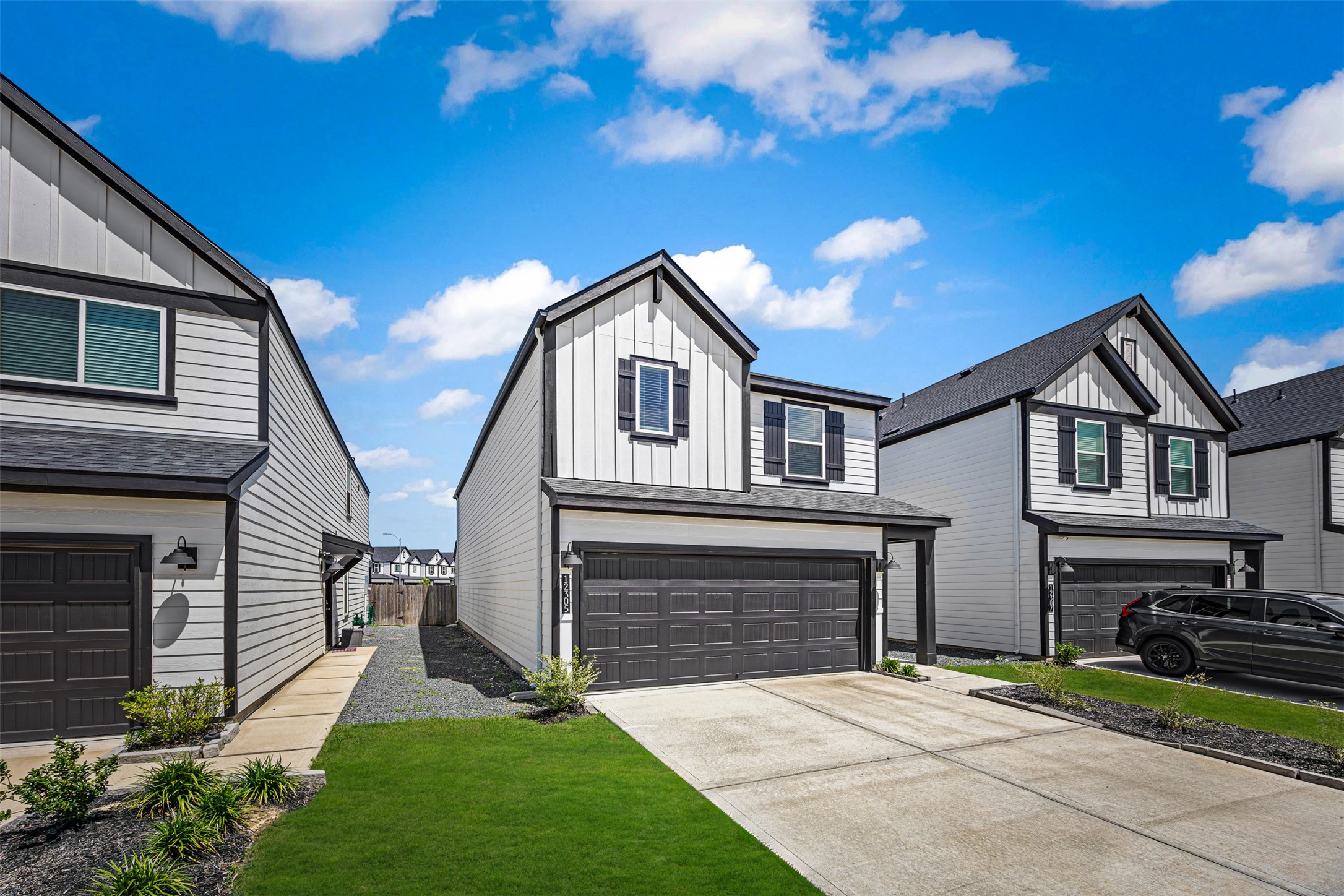 12305 Brandenburg Gate Road Houston, TX 77047 - Photo 3 of 22 a front view of a house with a garden