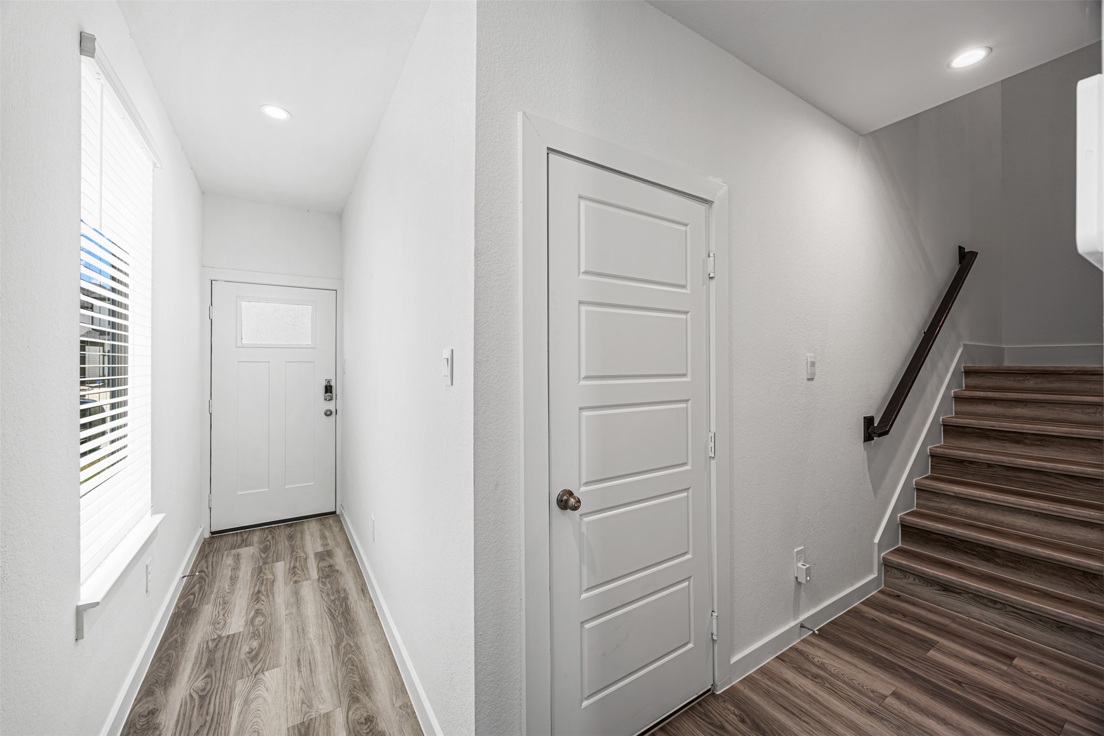 12305 Brandenburg Gate Road Houston, TX 77047 - Photo 4 of 22 a view of a hallway with wooden floor and entryway