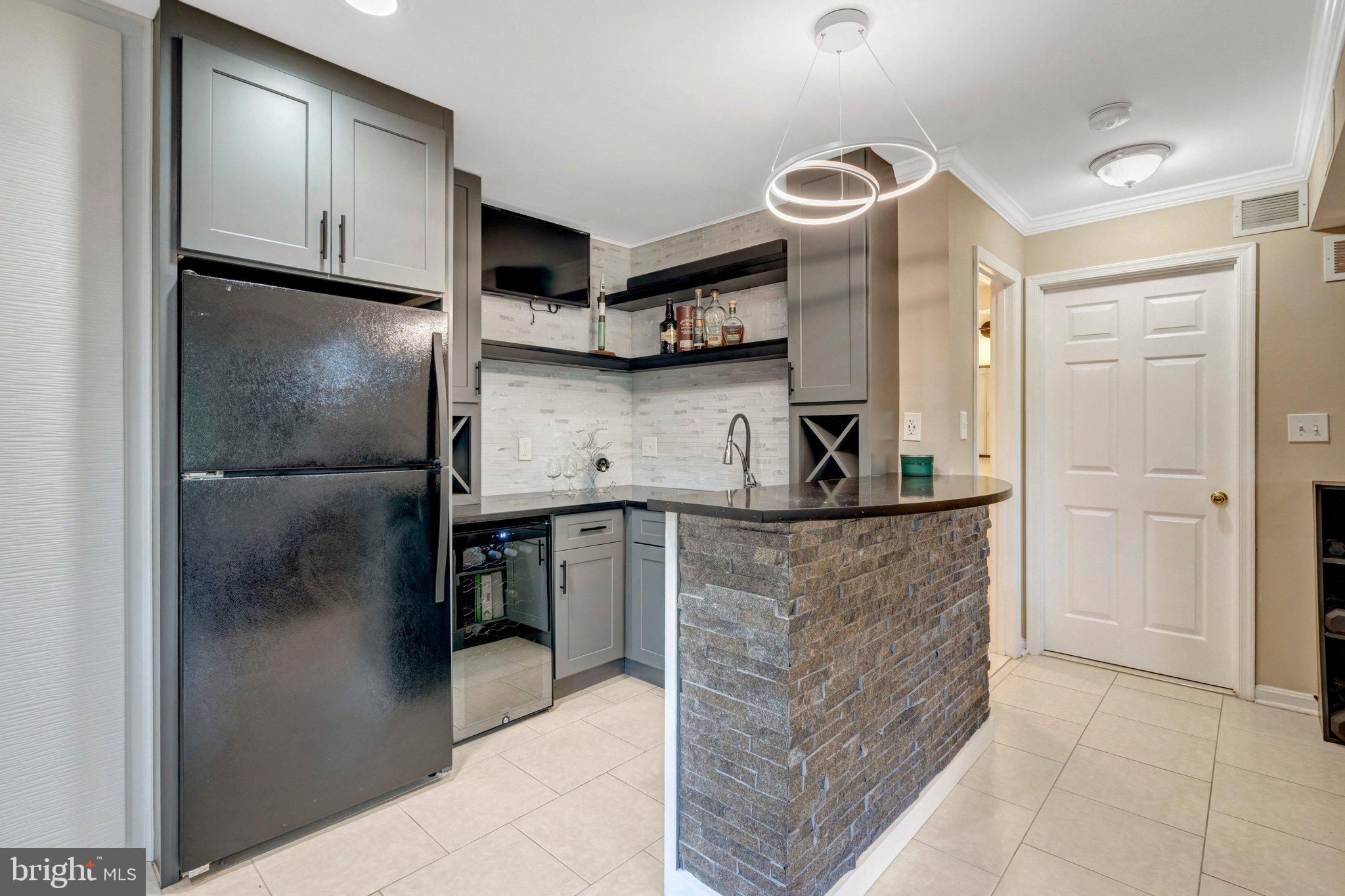 7212 Galgate Drive Springfield, VA 22153 - Photo 24 of 39 a kitchen with stainless steel appliances granite countertop a refrigerator and a sink