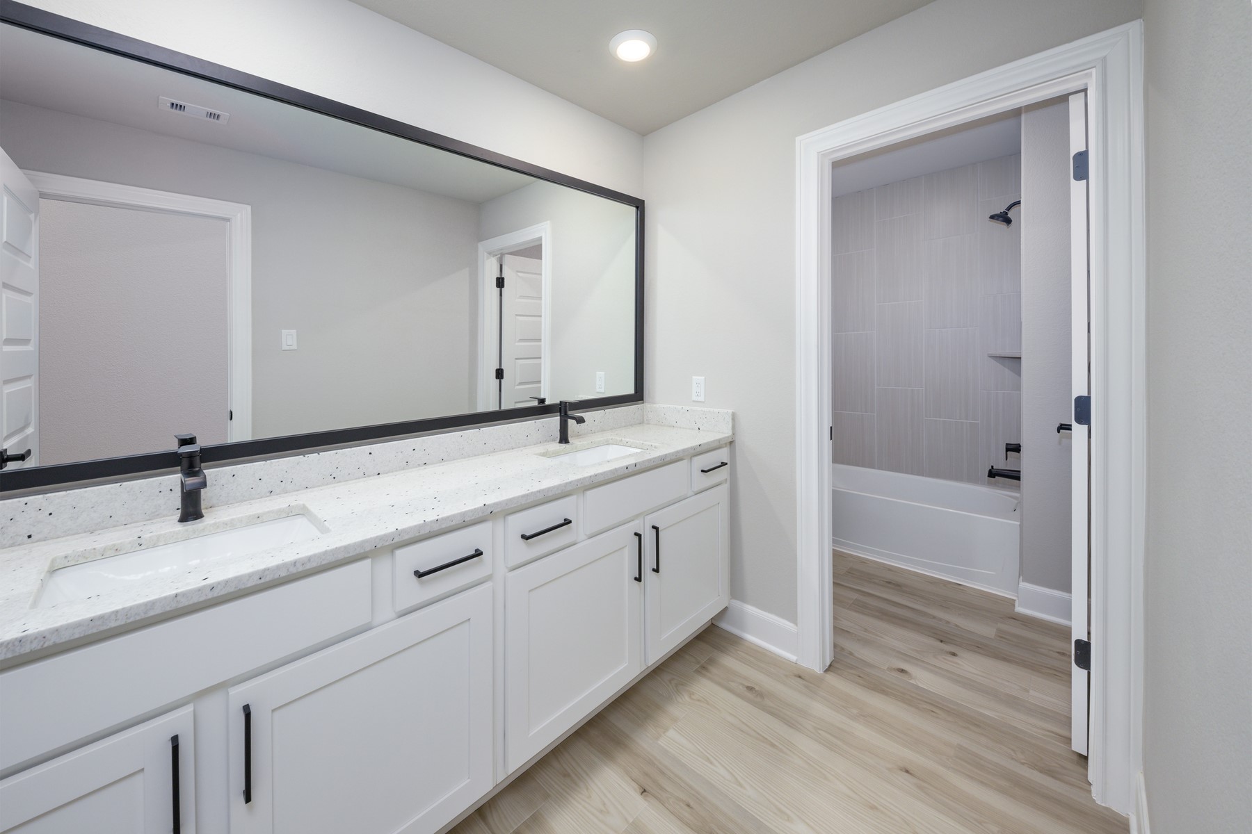 1926 June Lk Lane Iowa Colony, TX 77583 - Photo 11 of 15 Each bathroom has expansive vanities offering an abundance of storage below.