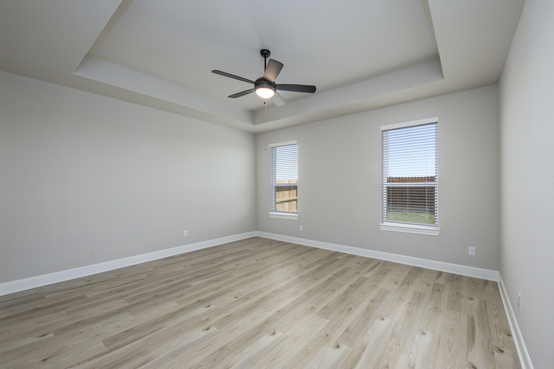 1926 June Lk Lane Iowa Colony, TX 77583 - Photo 4 of 15 Tucked away from the additional bedrooms, the master suite boasts beautiful high celings and plenty of natural light with views into the large back yard