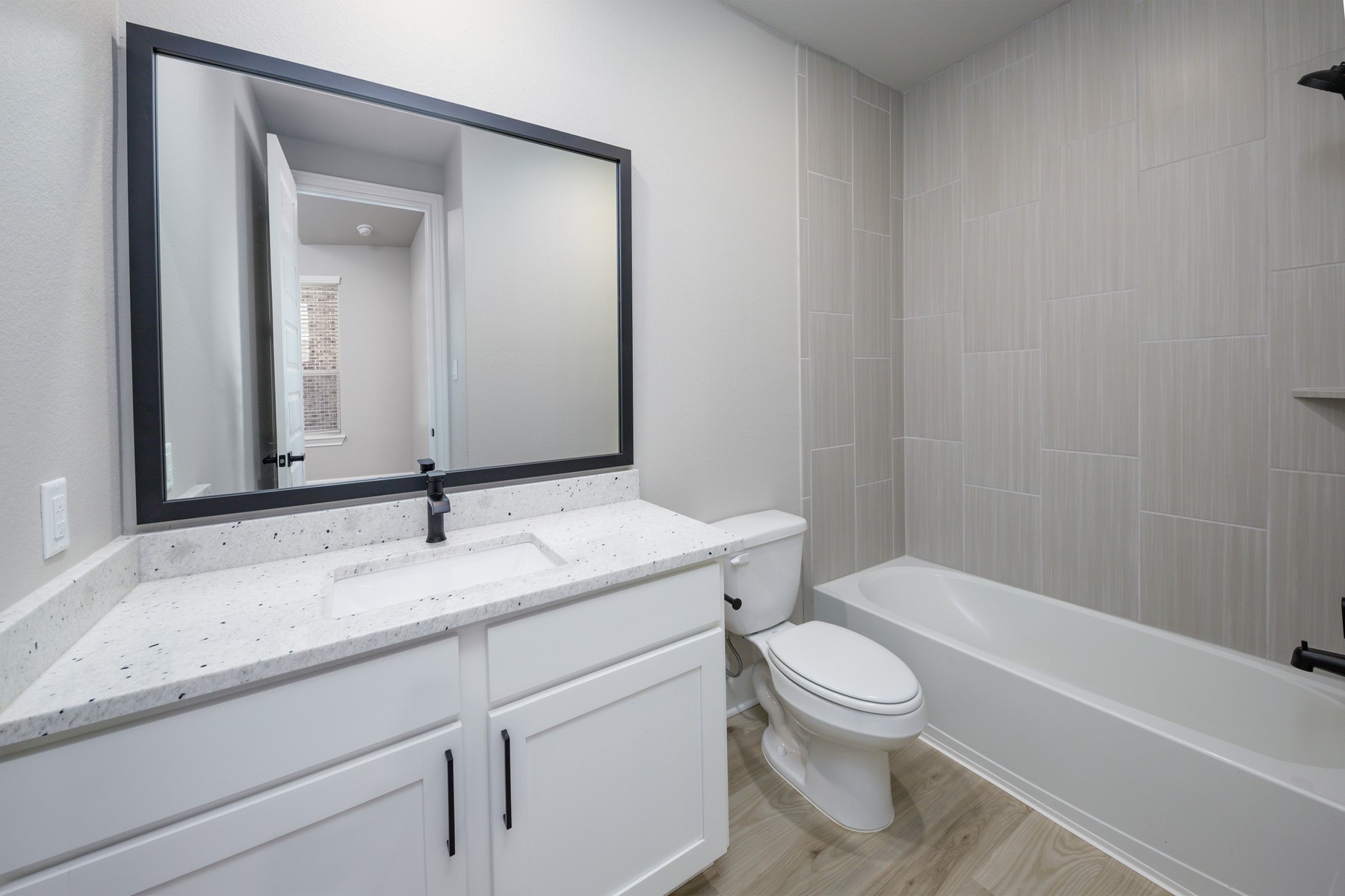 1926 June Lk Lane Iowa Colony, TX 77583 - Photo 7 of 15 Each bathroom has expansive vanities offering an abundance of storage below.