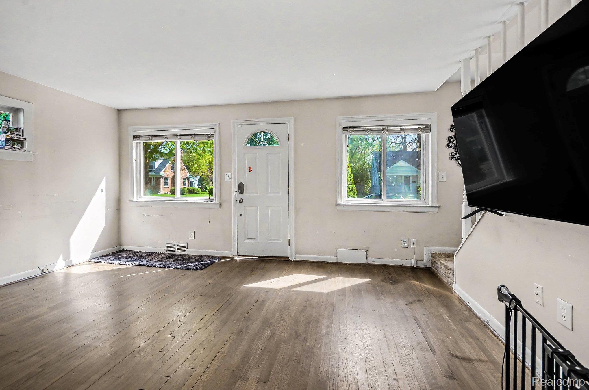 2126 Roslyn Road Grosse Pointe, MI 48236 - Photo 3 of 25 Foyer entrance featuring hardwood / wood-style floors and healthy amount of natural light