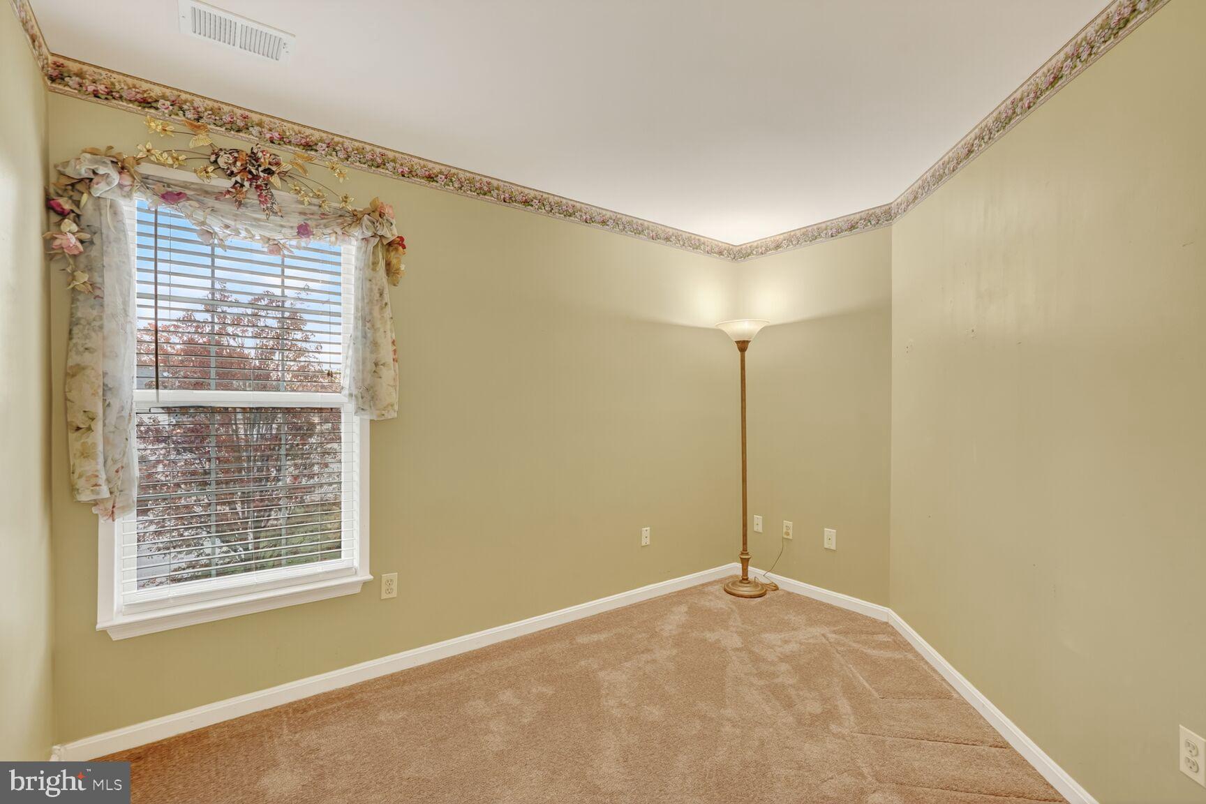 8205 Swamp Rose Place Laurel, MD 20724 - Photo 18 of 34 a view of a room with a large window