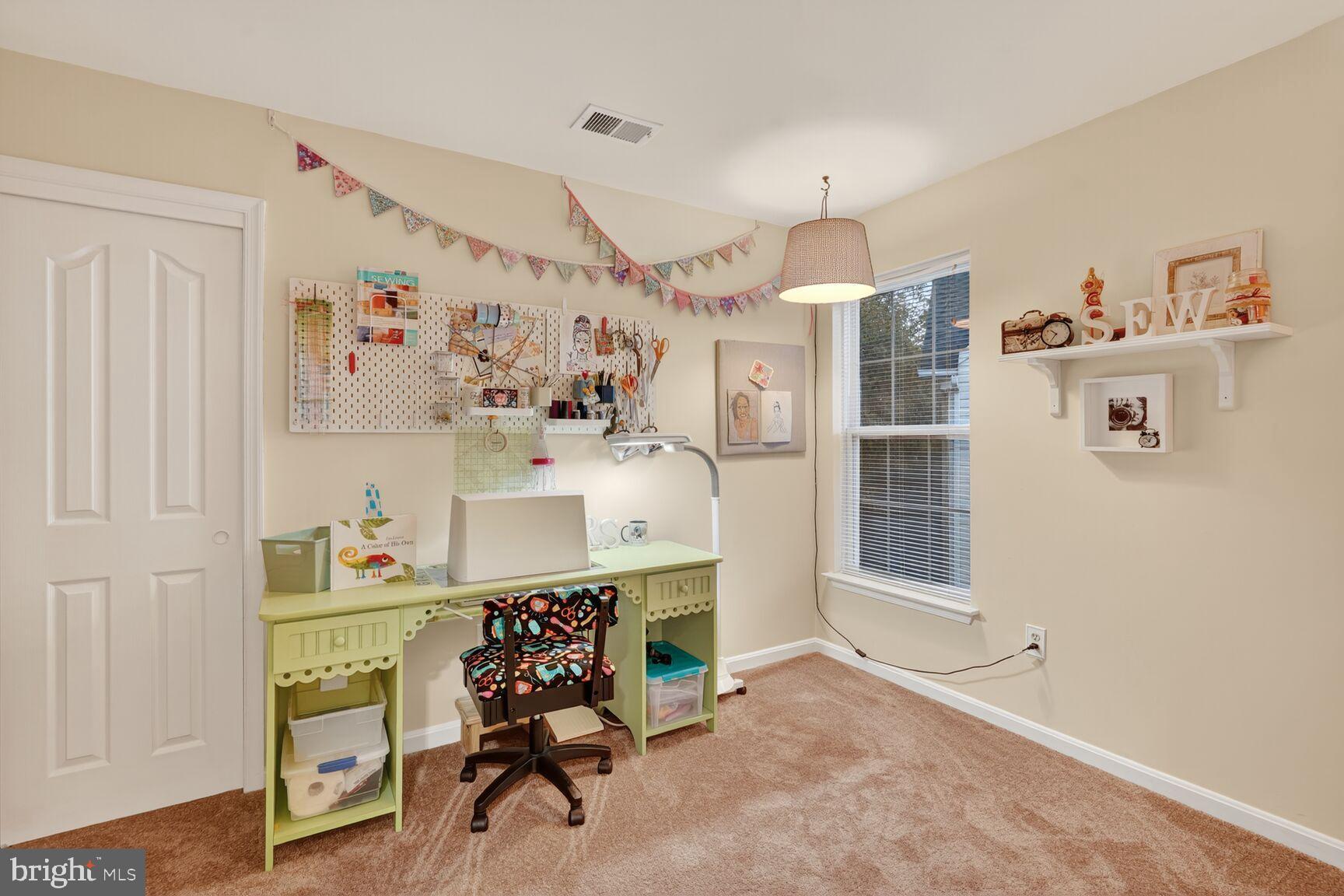 8205 Swamp Rose Place Laurel, MD 20724 - Photo 23 of 34 a workspace with furniture and a chandelier