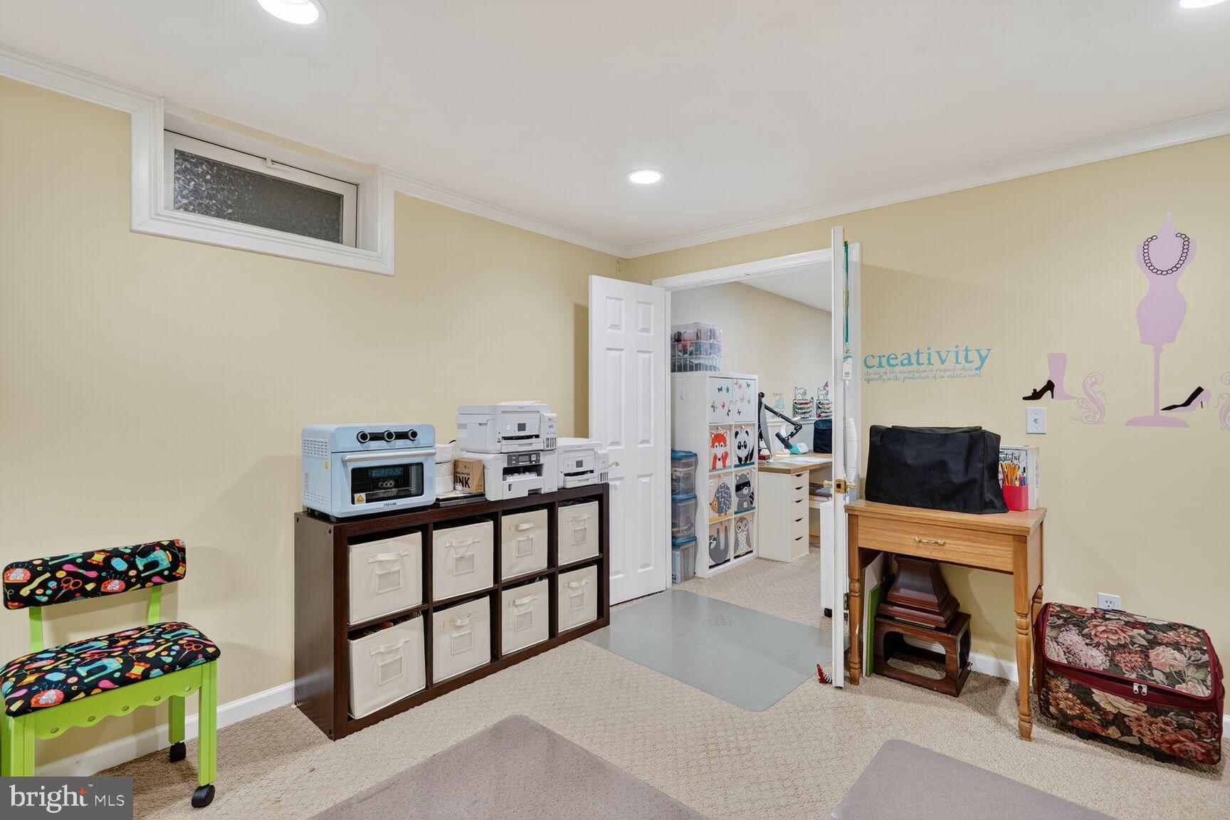 8205 Swamp Rose Place Laurel, MD 20724 - Photo 24 of 34 a room with furniture and a flat screen tv
