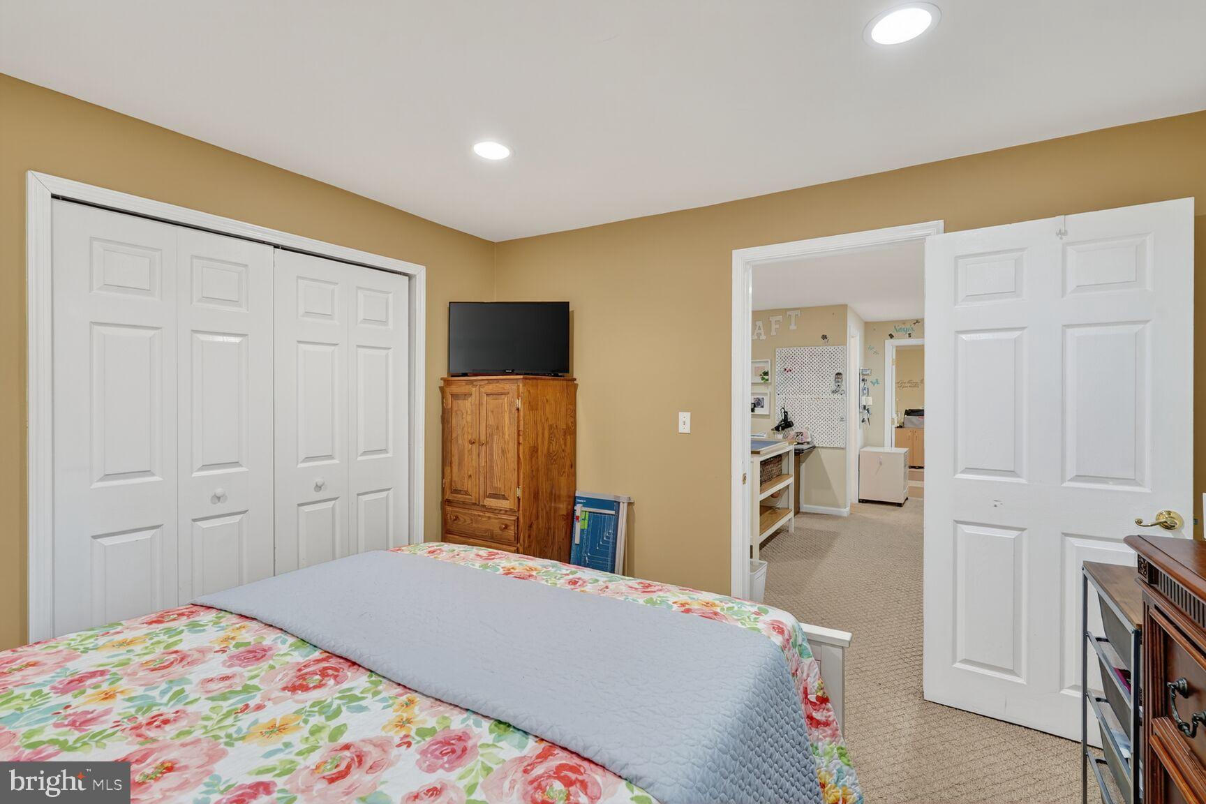 8205 Swamp Rose Place Laurel, MD 20724 - Photo 25 of 34 a bedroom with a bed and a cabinets