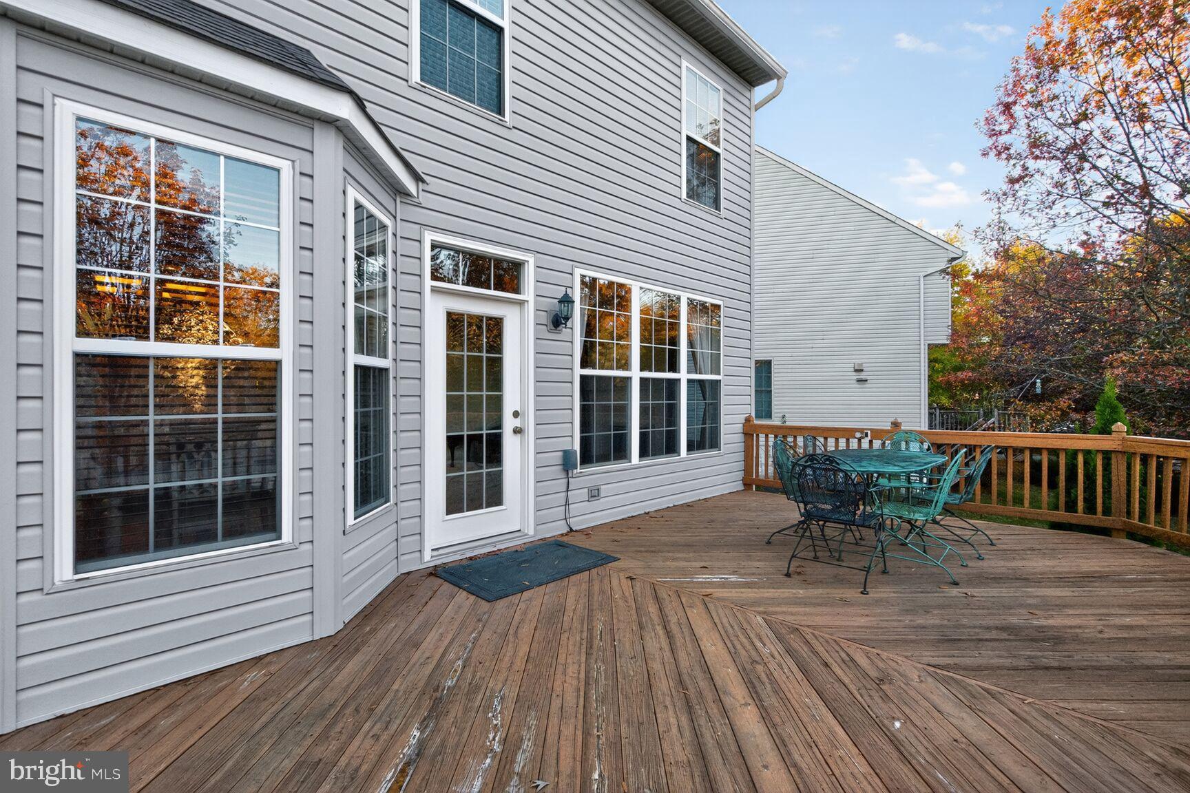 8205 Swamp Rose Place Laurel, MD 20724 - Photo 30 of 34 a view of a house with a lounge chair