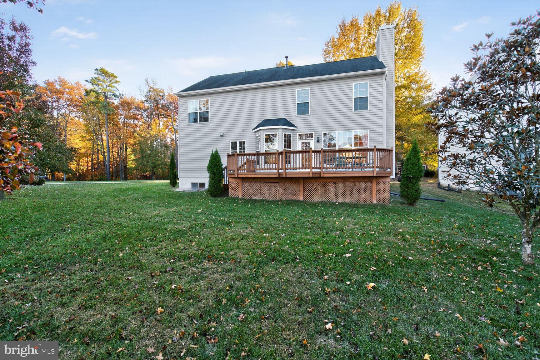 8205 Swamp Rose Place Laurel, MD 20724 - Photo 31 of 34 a view of a house with a big yard and large trees