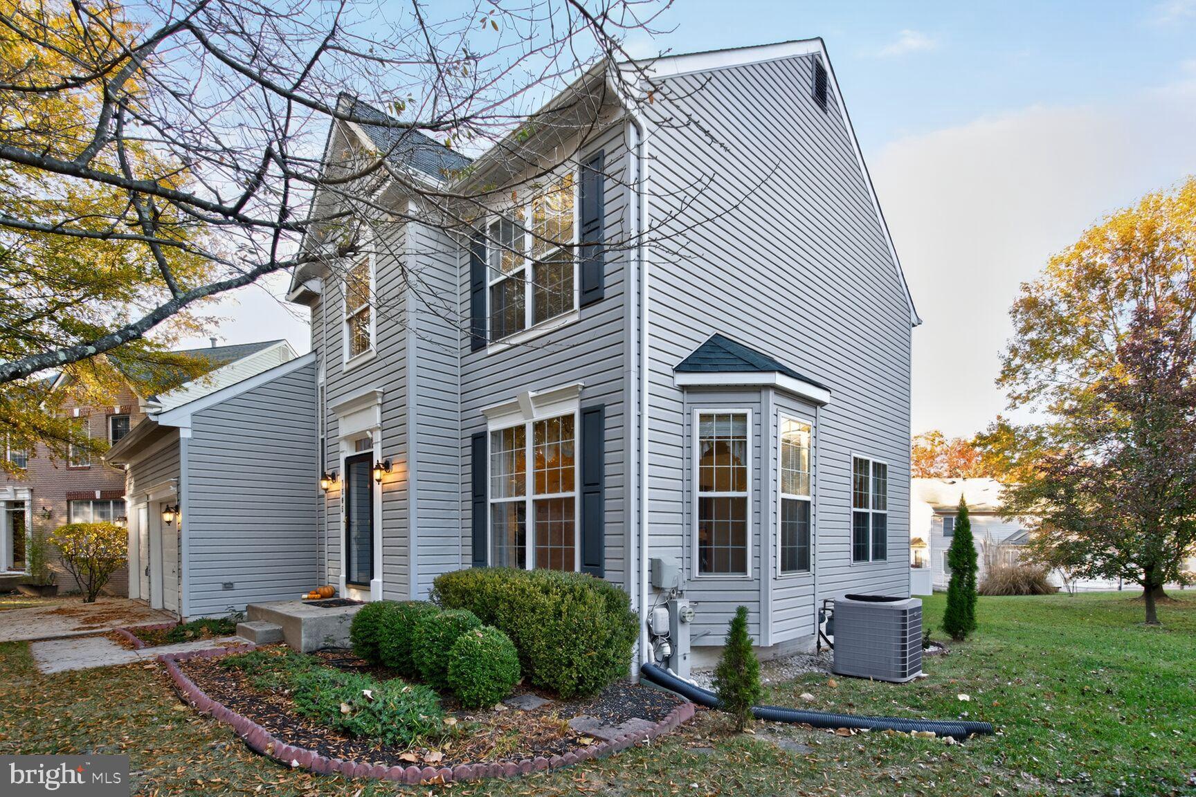 8205 Swamp Rose Place Laurel, MD 20724 - Photo 4 of 34 a front view of a house with garden