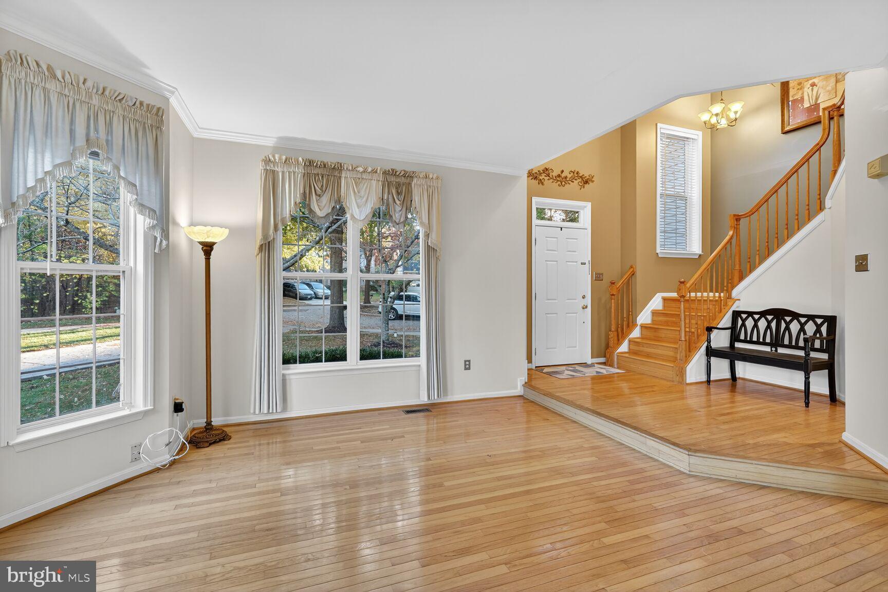 8205 Swamp Rose Place Laurel, MD 20724 - Photo 5 of 34 a view of an entryway with wooden floor and door