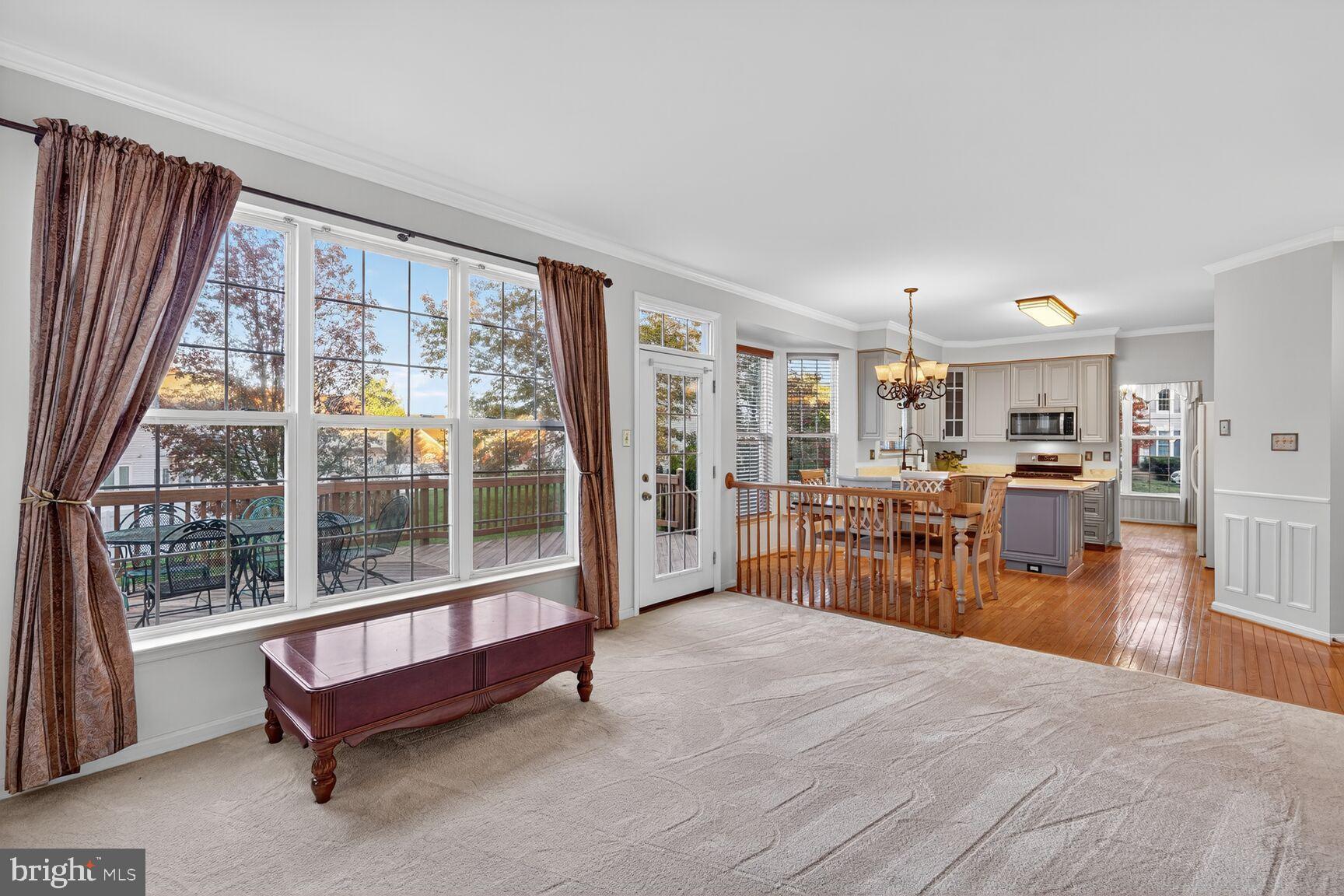 8205 Swamp Rose Place Laurel, MD 20724 - Photo 10 of 34 a living room with furniture and a table