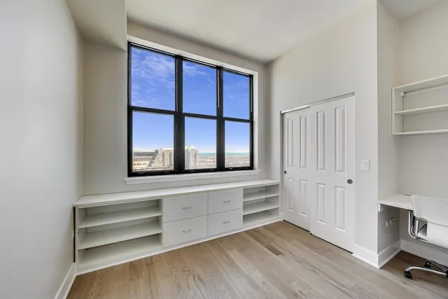 a view of an empty room and a window