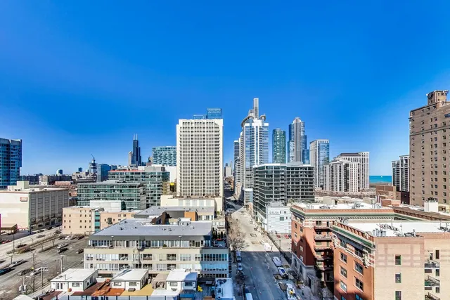 a view of city with tall buildings