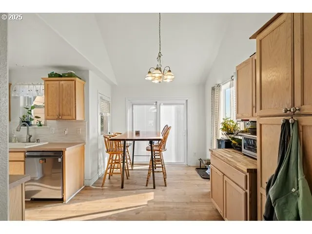 a dining room with furniture and a chandelier
