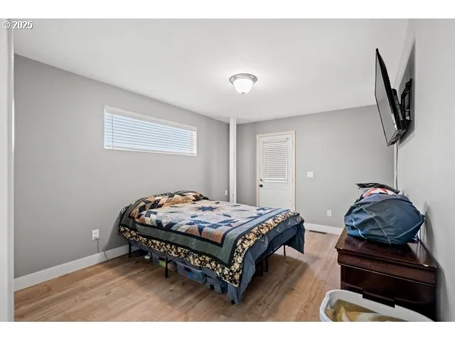 a bedroom with a bed and window