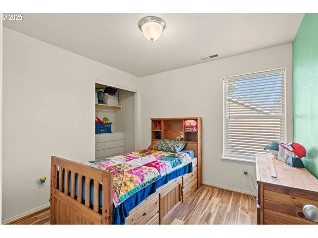 a bedroom with a bed and a table in it