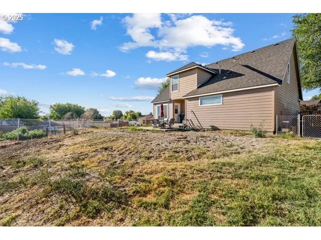 a house view with a backyard space