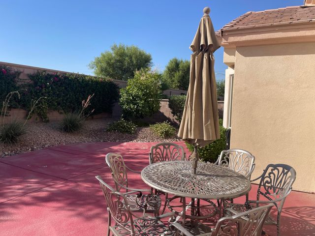 a outdoor dining space with furniture and outdoor seating
