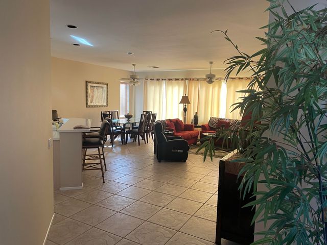 a lobby with furniture and floor to ceiling window
