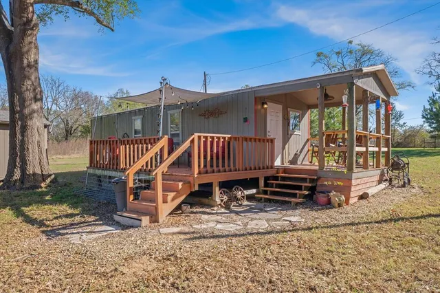 a kitchen with a refrigerator and a sink