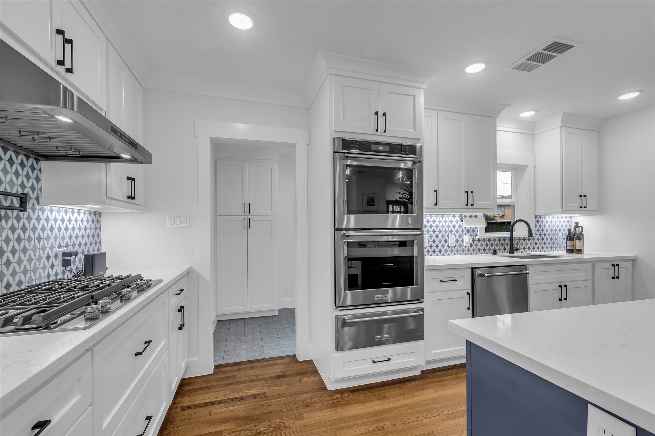 2611 Ruth Street Houston, TX 77004 - Photo 16 of 50 Another view of the kitchen shows the overall layout, with a backdoor entry also visible for convenient access.