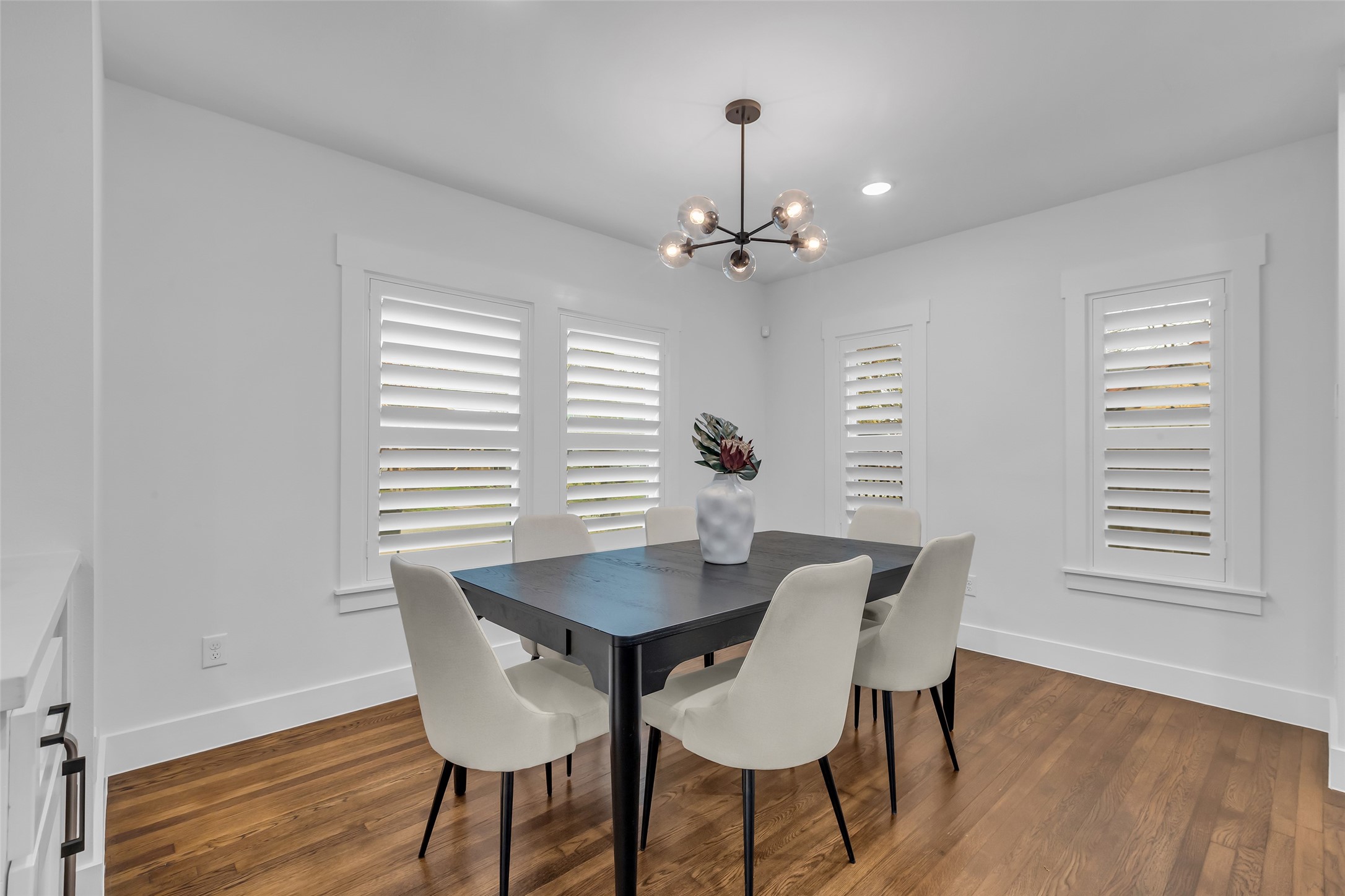 2611 Ruth Street Houston, TX 77004 - Photo 20 of 50 Natural light from the dining room windows brightens the space, creating a welcoming and open atmosphere.