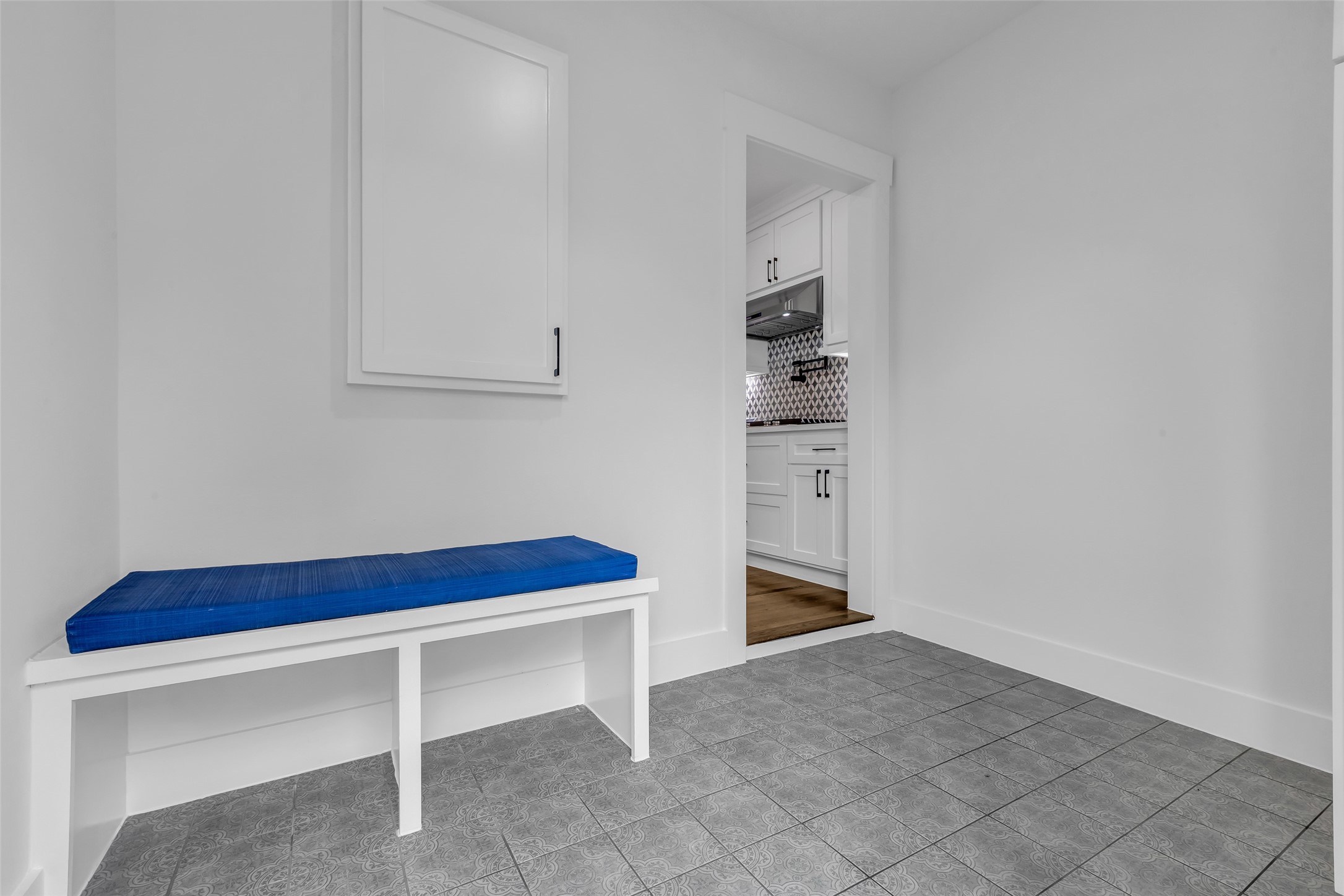 2611 Ruth Street Houston, TX 77004 - Photo 24 of 50 At the back of the kitchen, there is extra space (aka mudroom) near the back entry, featuring a bench and built-in storage.