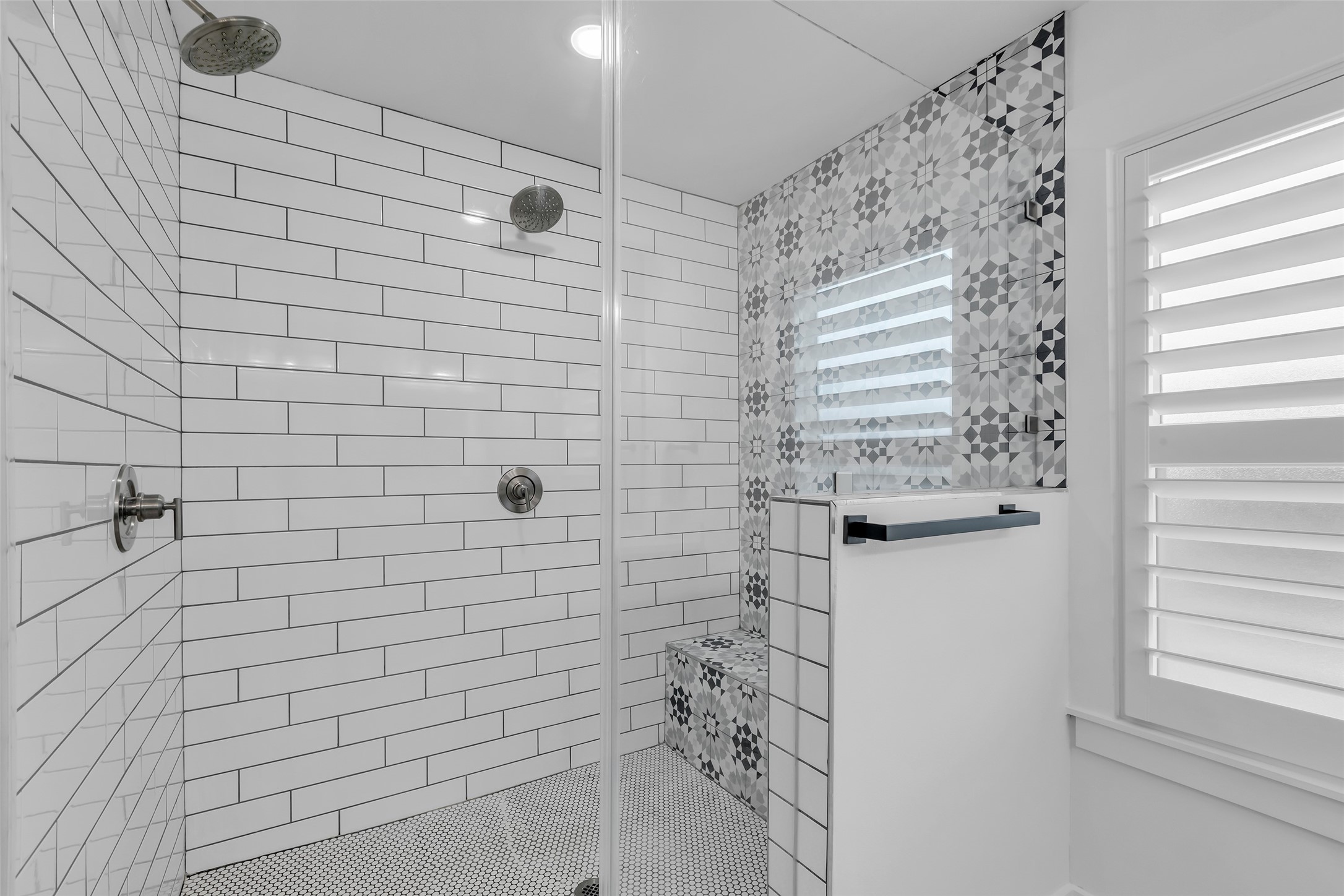 2611 Ruth Street Houston, TX 77004 - Photo 32 of 50 A closer view of the shower area shows tiled walls, creating a clean and easy-to-maintain space. Please note the dual shower heads.