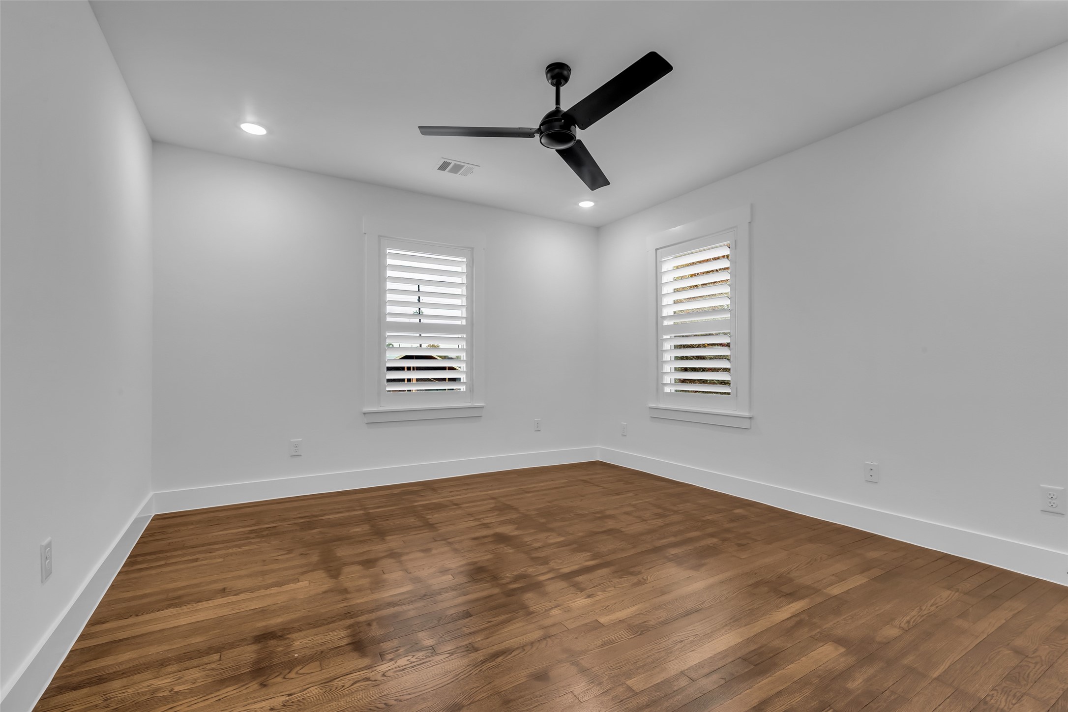 2611 Ruth Street Houston, TX 77004 - Photo 38 of 50 The 4th bedroom, located on the second-floor corner features original hardwood floors and two windows, allowing natural light to fill the room.