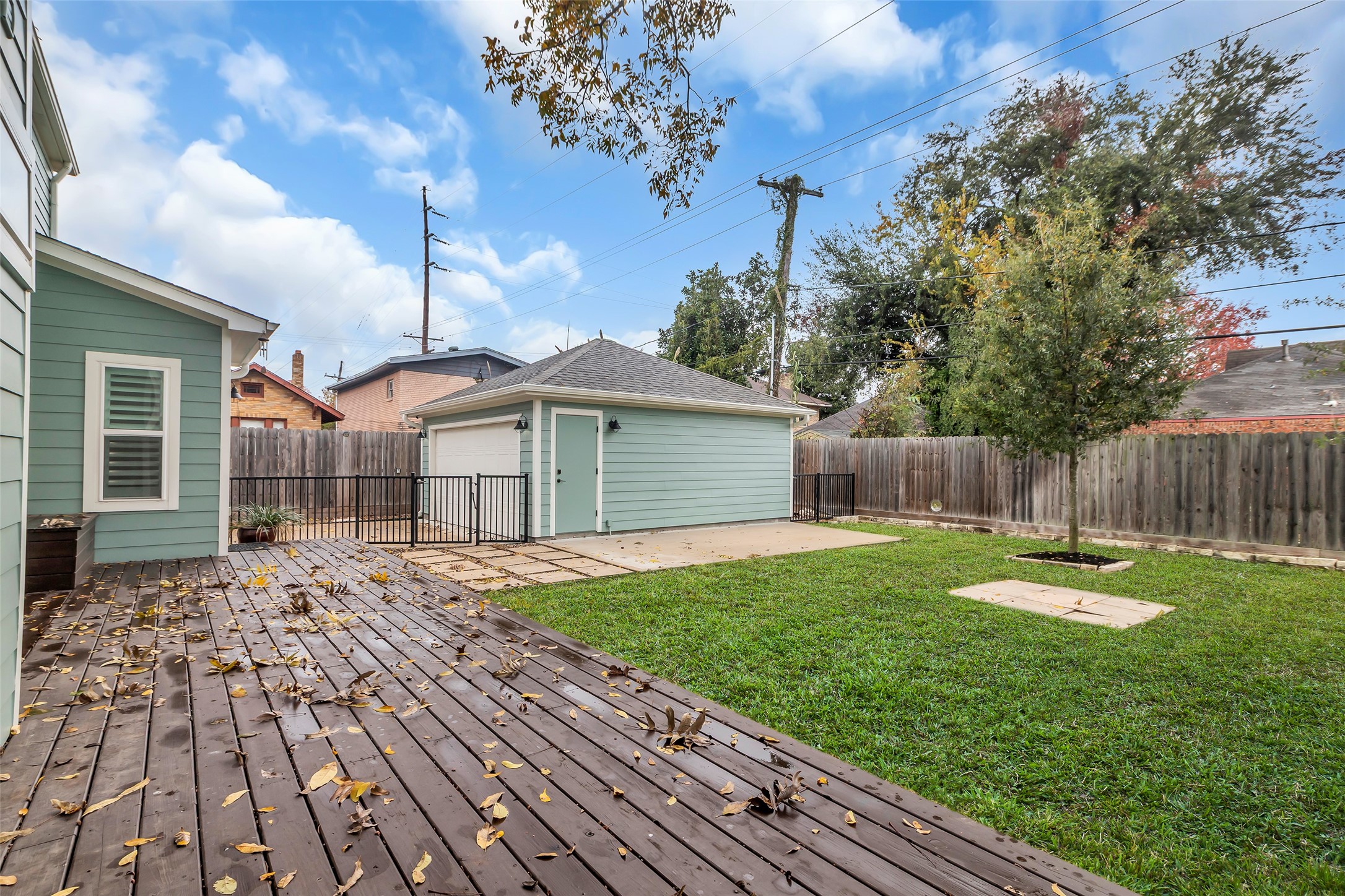 2611 Ruth Street Houston, TX 77004 - Photo 43 of 50 This view from the deck shows more of the backyard, highlighting the open space and landscaping.