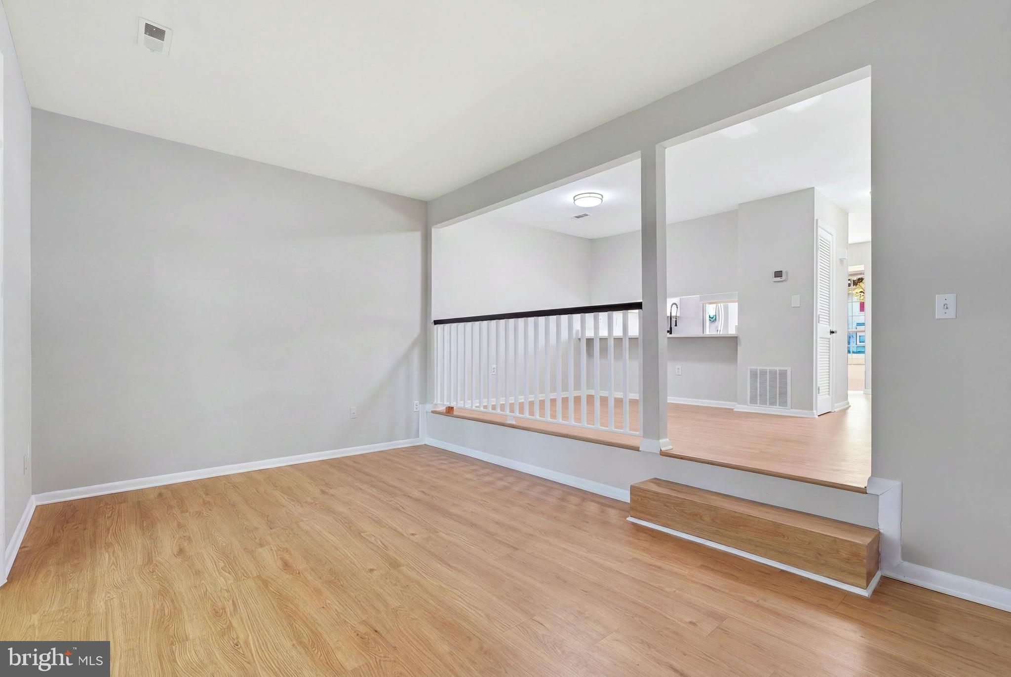 3682 Masthead Trail Triangle, VA 22172 - Photo 17 of 53 a view of a hallway with wooden floor