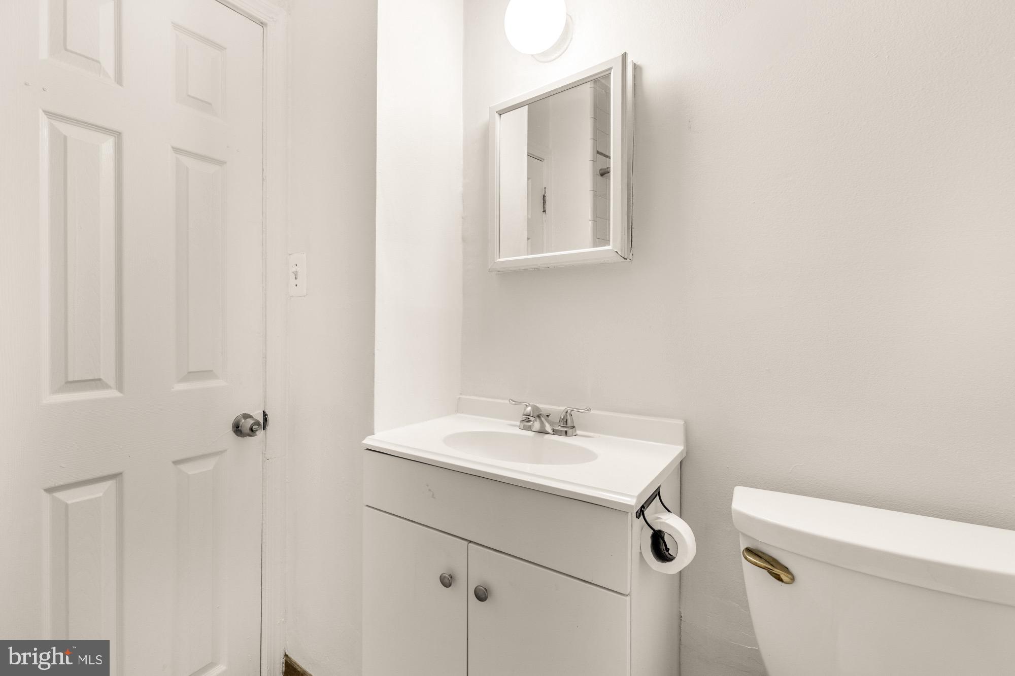 1102 K Street Southeast Washington, DC 20003 - Photo 27 of 30 a bathroom with a sink toilet and vanity