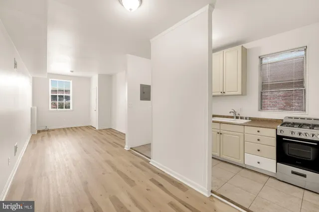 a front view of a house with a fence