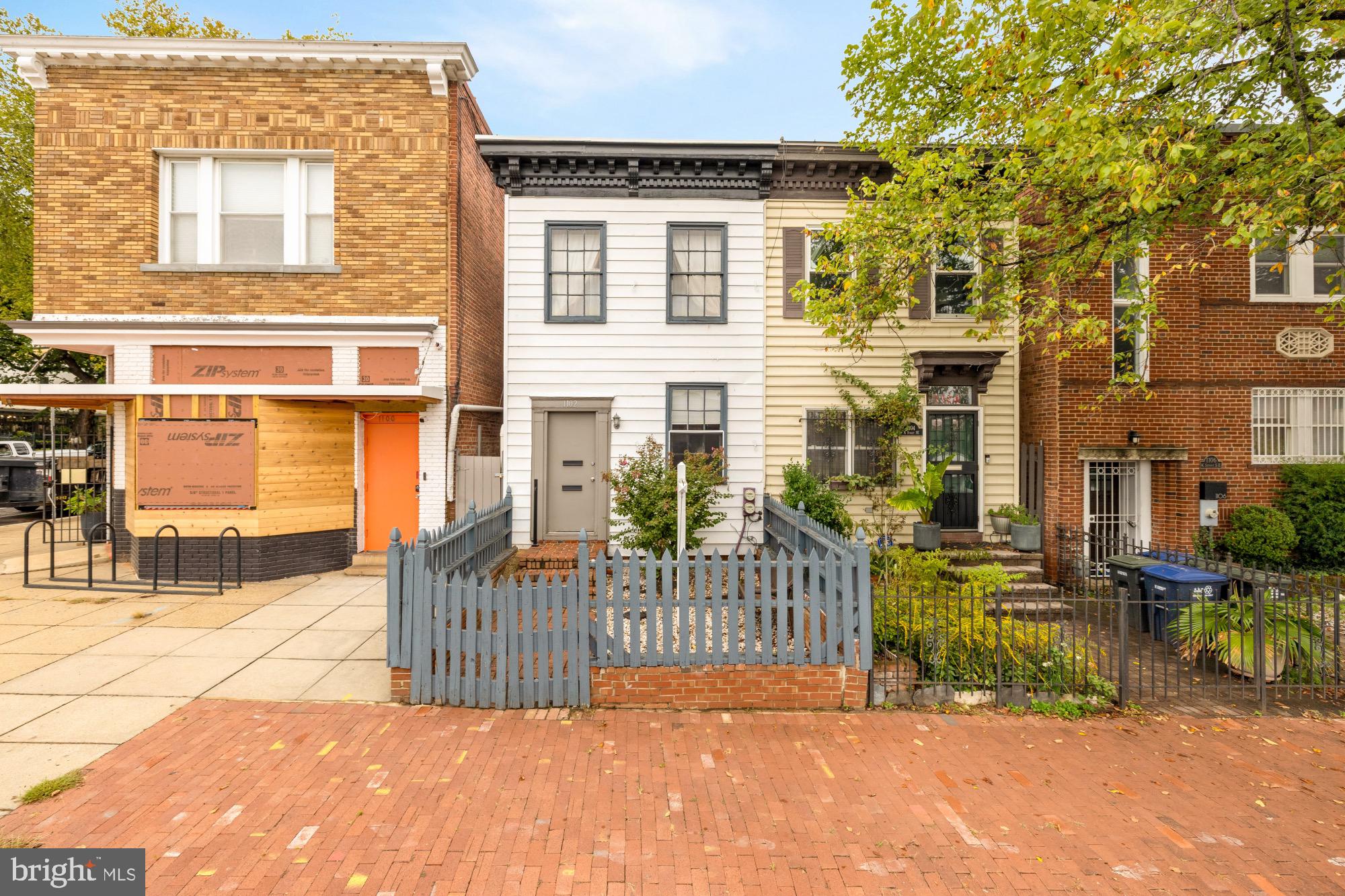 1102 K Street Southeast Washington, DC 20003 - Photo 10 of 30 a front view of a house with a fence