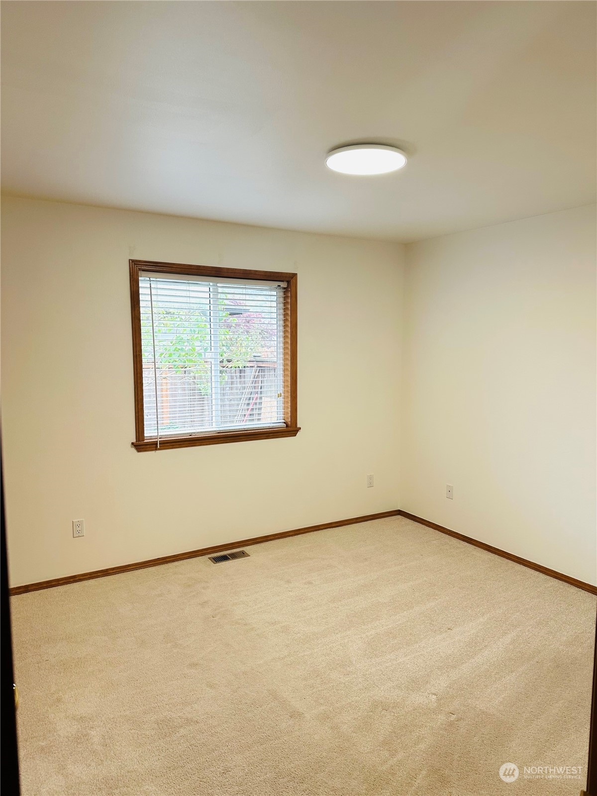 8625 Myrtle Road Northwest Stanwood, WA 98292 - Photo 11 of 23 a view of an empty room with a window