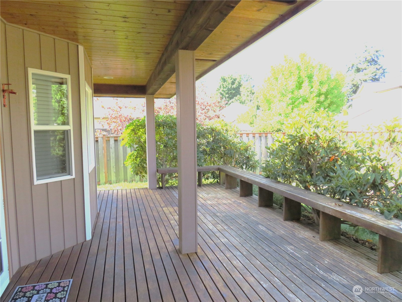 8625 Myrtle Road Northwest Stanwood, WA 98292 - Photo 18 of 23 a view of a porch with wooden floor and outdoor space
