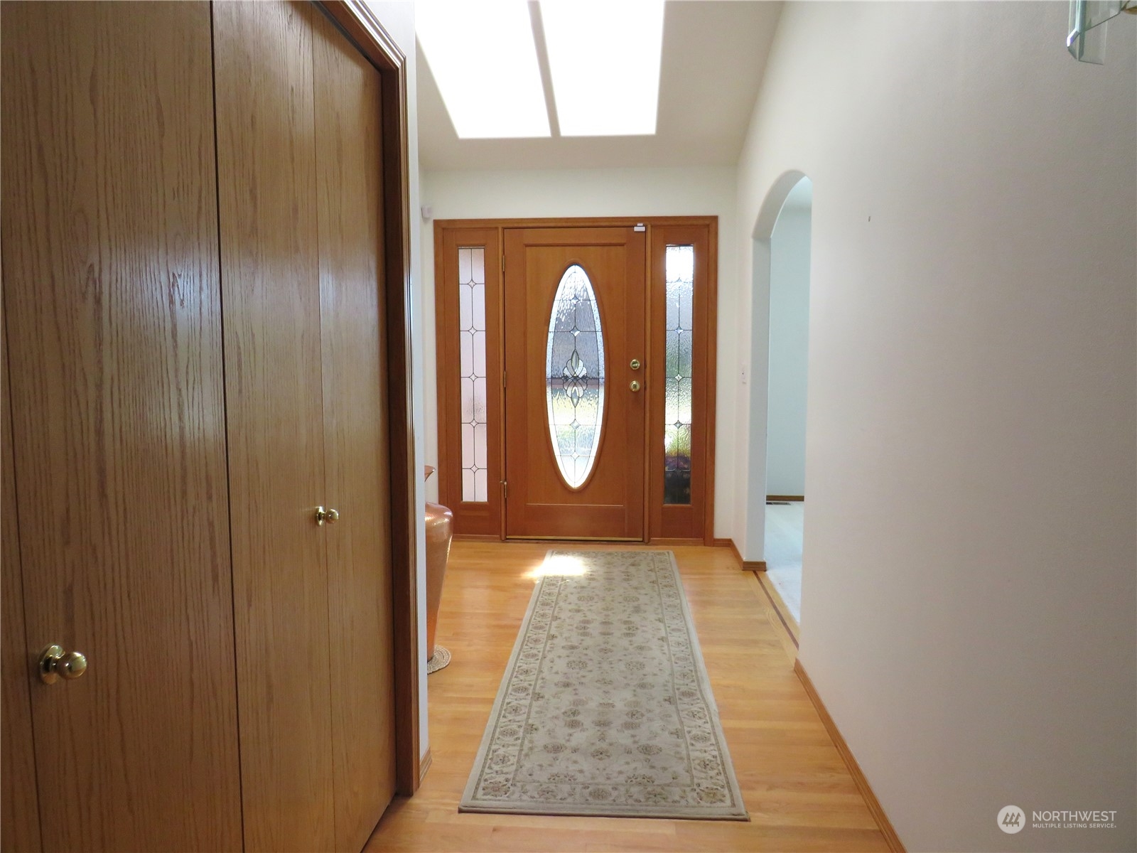 8625 Myrtle Road Northwest Stanwood, WA 98292 - Photo 23 of 23 a view of a hallway with wooden floor