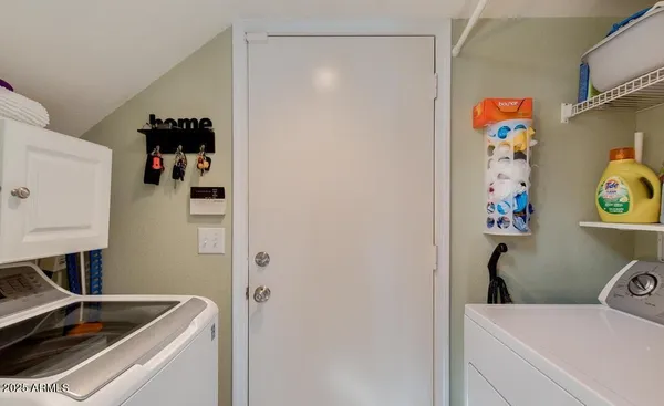 a utility room with a window dryer and washer