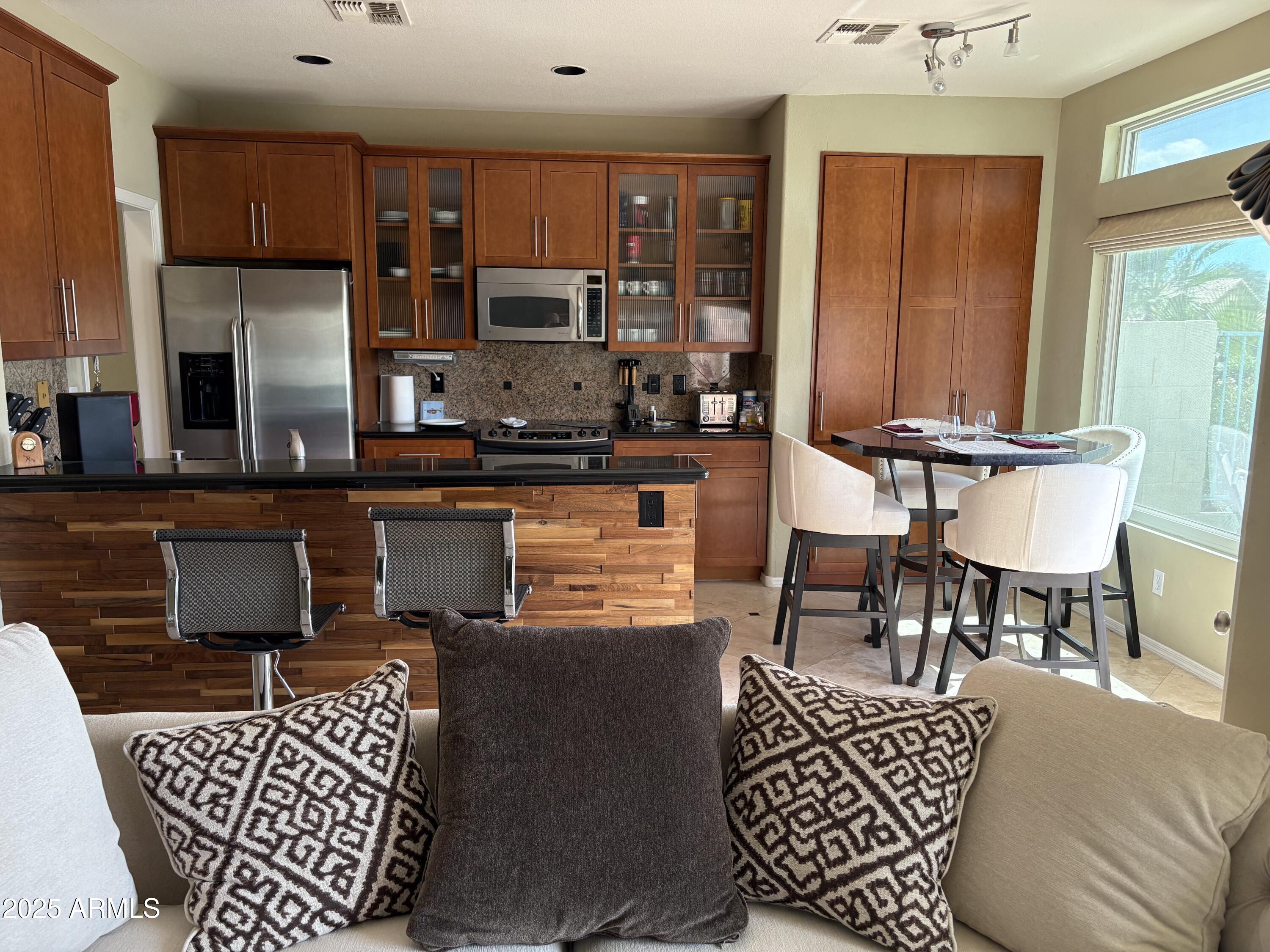1139 East Frye Road Phoenix, AZ 85048 - Photo 8 of 17 a living room with furniture a rug and a window
