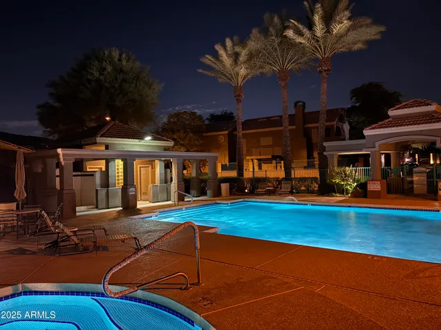 a view of a swimming pool with seating area